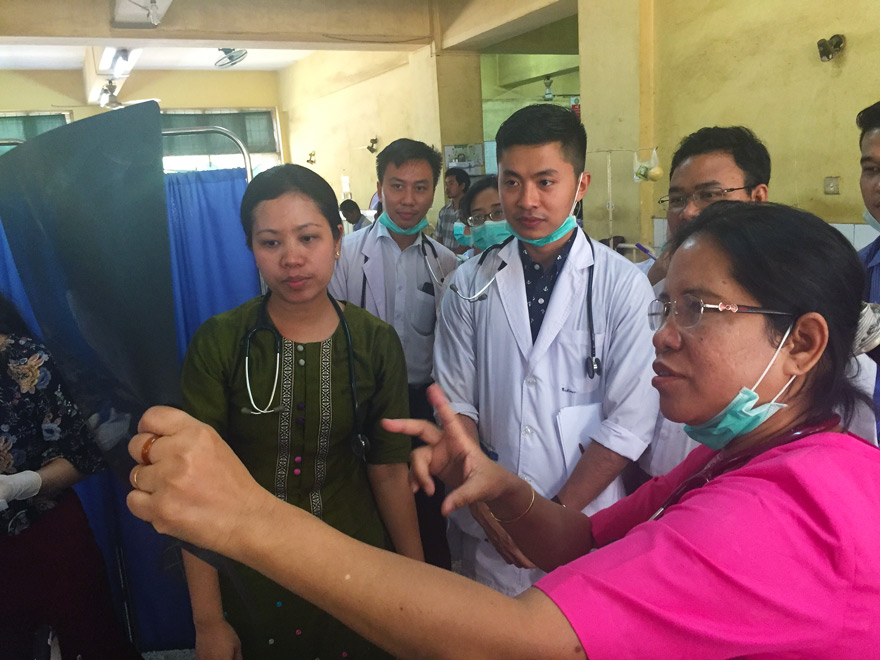 Professor Mar Mar Kyi teaches her team on a ward round at Insein General Hospital.