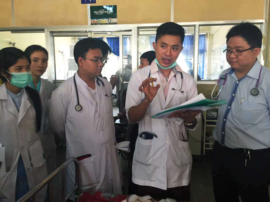 Dr Ne Lin Tun (far right) with his team on a ward round at IGH.