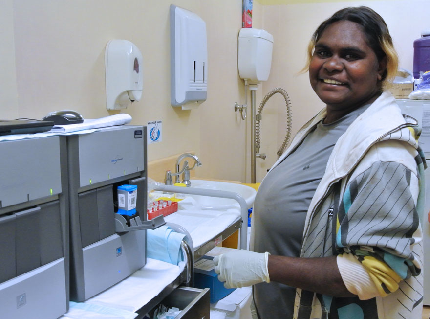 An Aboriginal Health Worker using the GeneXpert testing platform to conduct an STI test as part of the TTANGO trial.