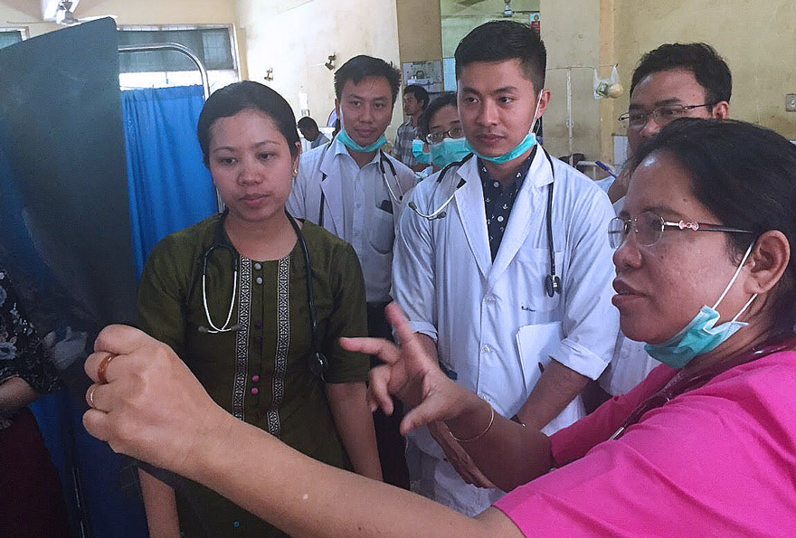 Professor Mar Mar Kyi teaching junior colleagues on her daily ward round at Insein General Hospital